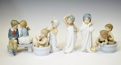 Lot 659 - Lladro - Four porcelain 'Bath Time’ figures