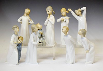 Lot 634 - Lladro - Group of seven porcelain figures of children in nightwear