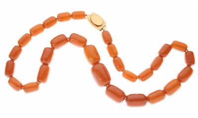 Lot 307 - String of graduated amber-coloured bakelite beads