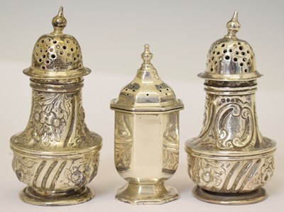 Lot 393 - Pair of Victorian silver pepperettes, together with an Edward VII silver pepperette