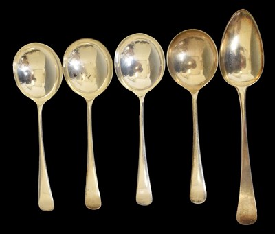 Lot 404 - Set of four George VI silver soup spoons, and a George III silver tablespoon