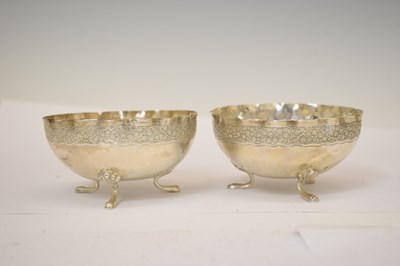 Lot 436 - Pair of 20th century Middle Eastern white metal footed bowls