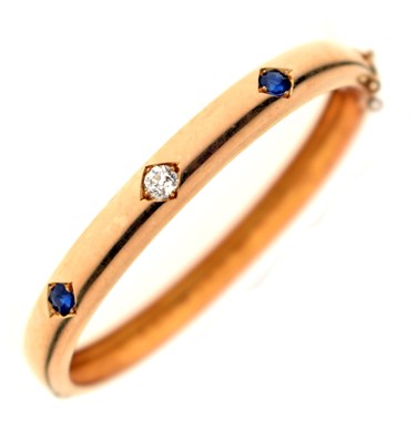 Lot 56 - Victorian diamond and sapphire unmarked yellow metal hinged bangle