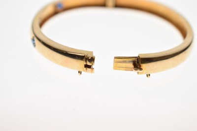 Lot 56 - Victorian diamond and sapphire unmarked yellow metal hinged bangle