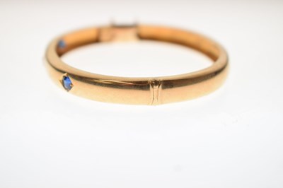 Lot 56 - Victorian diamond and sapphire unmarked yellow metal hinged bangle