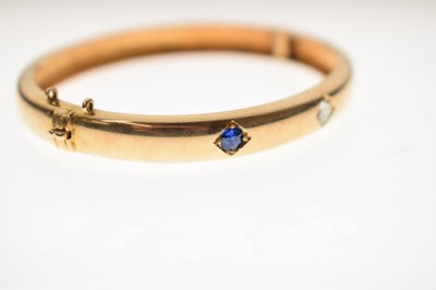 Lot 56 - Victorian diamond and sapphire unmarked yellow metal hinged bangle