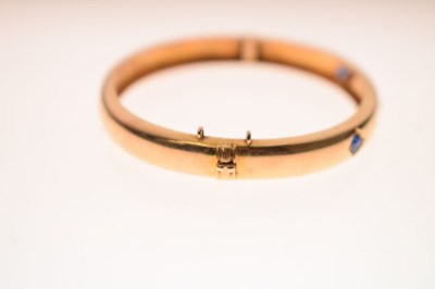 Lot 56 - Victorian diamond and sapphire unmarked yellow metal hinged bangle