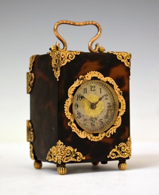 Lot 438 - Late 19th century French tortoiseshell and yellow metal-mounted boudoir or travel clock