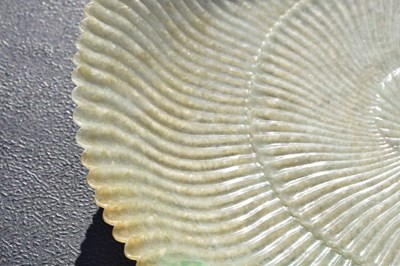 Lot 323 - Chinese celadon jade 'Chrysanthemum' dish