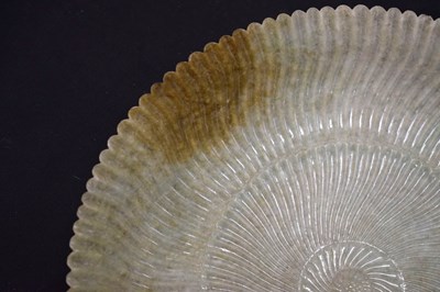 Lot 323 - Chinese celadon jade 'Chrysanthemum' dish