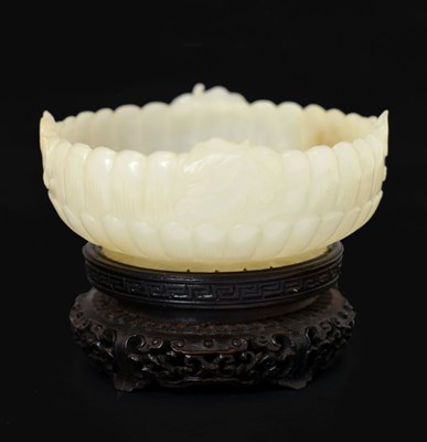 Lot 321 - Chinese carved celadon jade 'Chrysanthemum' bowl
