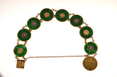 Lot 65 - Chinese jade and yellow metal 'coin' bracelet, Wang Hing, Hong Kong