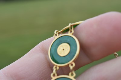 Lot 65 - Chinese jade and yellow metal 'coin' bracelet, Wang Hing, Hong Kong