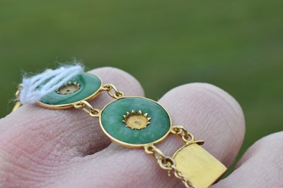 Lot 65 - Chinese jade and yellow metal 'coin' bracelet, Wang Hing, Hong Kong