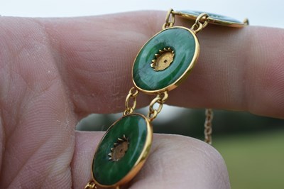 Lot 65 - Chinese jade and yellow metal 'coin' bracelet, Wang Hing, Hong Kong