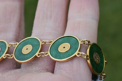 Lot 65 - Chinese jade and yellow metal 'coin' bracelet, Wang Hing, Hong Kong
