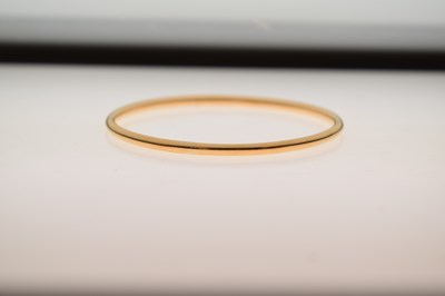 Lot 57 - Eastern high carat yellow metal bangle