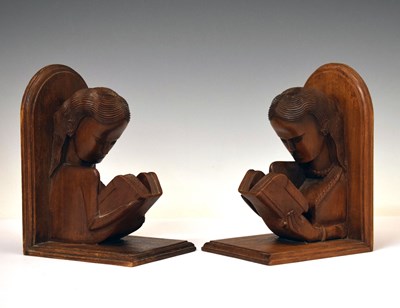 Lot 509 - Pair of carved wooden bookends