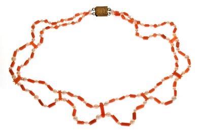 Lot 136 - Coral and pearl two-strand necklace with yellow metal clasp