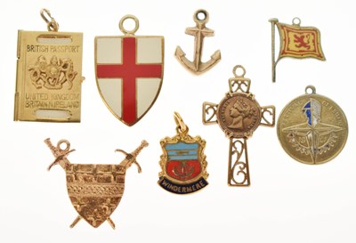 Lot 245 - Assorted 9ct gold and yellow metal charms including 1951 Festival, passport etc