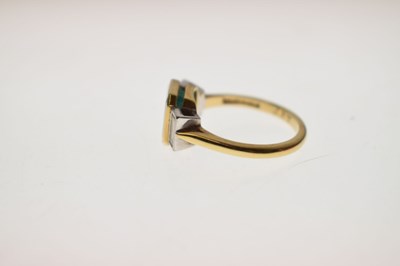 Lot 23 - Emerald and diamond 18ct yellow gold and white gold set three stone ring