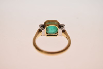 Lot 23 - Emerald and diamond 18ct yellow gold and white gold set three stone ring