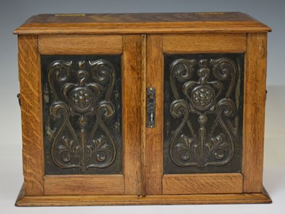 Lot 537 - Early 20th century oak Art Nouveau smoker's cabinet
