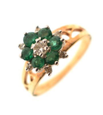 Lot 36 - Emerald and diamond 18ct gold flowerhead dress ring