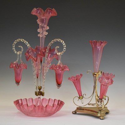 Lot 547 - Two cranberry glass epergnes