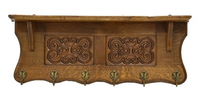 Lot 811 - Early 20th century carved oak coat rack