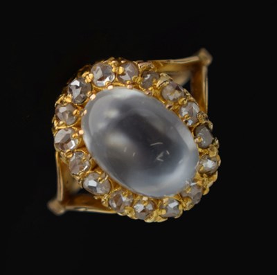 Lot 20 - Moonstone and diamond yellow metal cluster ring