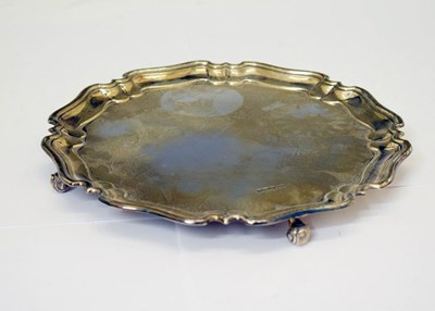 Lot 417 - George V silver salver with pie crust edge on ball feet