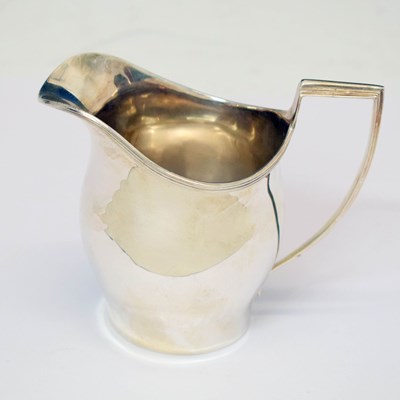 Lot 423 - George V silver helmet shaped cream jug