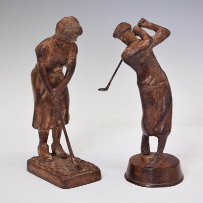 Lot 403 - Two patinated iron figures of golfers