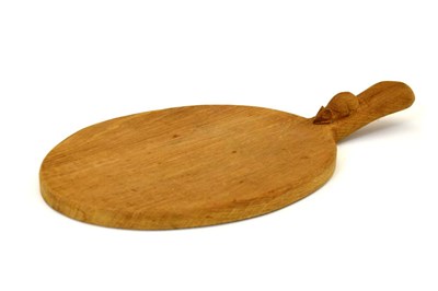 Lot 293 - Workshop of Robert 'Mouseman' Thompson, late 20th Century English oak oval cheese board