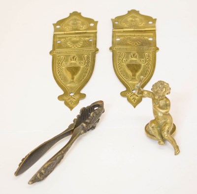 Lot 390 - Pair of sheet brass hinges, bronze cherub, bronze nutcrackers