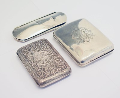 Lot 243 - Late Victorian silver cigarette case, white metal cigarette case, and a glasses case