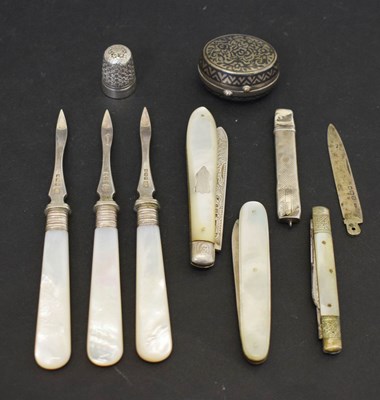 Lot 245 - Three silver and mother-of-pearl folding fruit knives, three George V picks, etc
