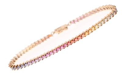 Lot 126 - Fancy sapphire 'rainbow' 9ct gold bracelet