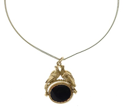 Lot 102 - 9ct gold lovebird swivel fob set carnelian and onyx