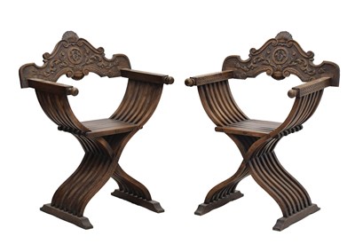 Lot 802 - Pair of carved fruitwood X-frame folding Savonarola chairs