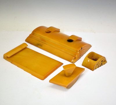Lot 362 - Four Art Deco amber Bakelite desk items