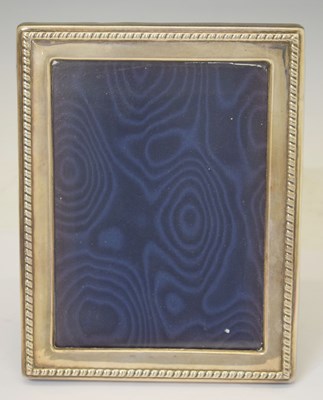Lot 284 - Elizabeth II silver mounted photograph frame with gadroon border