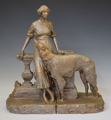 Lot 415 - Circa 1930s plaster figure group of a lady with dog