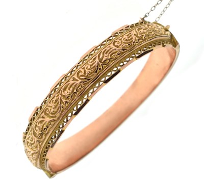 Lot 120 - Early 20th century 9ct rose gold hinged bangle