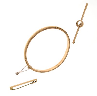 Lot 125 - 9ct gold bamboo design bangle and two '9ct' bar brooches