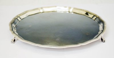 Lot 268 - Elizabeth II silver salver with gadroon rim and standing on three claw and ball feet