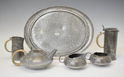 Lot 424 - English Pewter four piece tea set, after a design by Archibald Knox