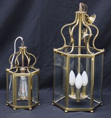 Lot 474 - Two octagonal brass and glass panelled hall lanterns