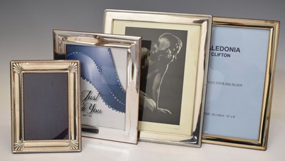 Lot 290 - Four Elizabeth II silver mounted easel photo frames